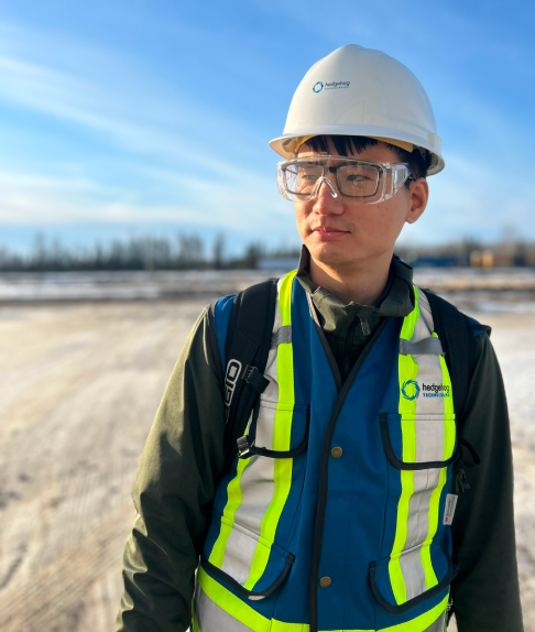 A man wearing safety gear looking off to the side.